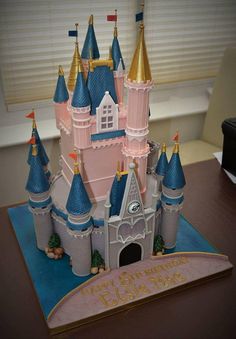 a cake shaped like a castle on top of a table