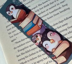 an open book with penguins reading books on top of it and another penguin sitting in the middle