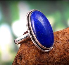 This Bohemian Ring is made from 925 Sterling silver and is studded with Natural Lapis Lazuli Stone.  This Ring is finely polished to give a brilliant mirror finish. With rejuvenating design and sleek appearance, this Ring will looks stunning on you in all type of functions and festivals. >> I T E M - D E T A I L S << Stone : Natural Lapis Lazuli  Stone Shape : Oval Cabochon  Metal : 925 Pure Sterling Silver  If you have any query feel free to ask, we love to help you. For more Visit : VeroJewels Bohemian Oval Hallmarked Rings, Handmade Silver Ring, Bohemian Jewellery, Bohemian Ring, Lapis Lazuli Stone, Bohemian Rings, Ring Oval, Boho Ring, Silver Rings Handmade