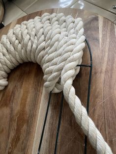 a white rope on top of a wooden table