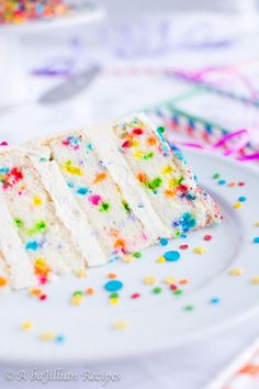 a piece of cake on a plate with sprinkles