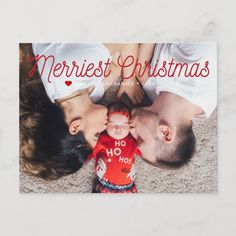 a merry christmas card with an image of a couple kissing on the cheek and holding hands