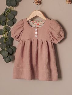 This Bonn Dress (2T) is made with eyelet double gauze. It has button front and balloon style short sleeves.  Because this is a handmade dress, the fit is different than store bought clothes. Please check the measurements below to make sure it fits correctly. Suitable for the body measurements: >Height- 35" >Chest- 20 1/2" >Waist- 21" >Hip- 21" Finished Dress Length-18 7/8" ✿ For custom made/"made to order" orders, please feel free to message me! ✿ Fabrics: Main-Eyelet Double Gauze, Lining-100% C Cute Short Sleeve Dress With Button Closure, Cotton Puff Sleeve Playtime Dresses, Cotton Puff Sleeve Dresses For Playtime, Cotton Puff Sleeve Dress With Button Closure, Double Gaze, Handmade Dress, Double Gauze, Handmade Dresses, Handmade Clothes