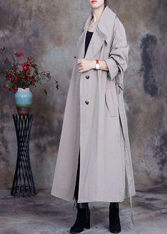 Plus Size Grey tie waist button Peter Pan Collar Trench coats SpringFabric: Cotton BlendedSize & Fit: Fit: This garment fits true to size.Length: Size 4XL measures 44.07"from shoulder to hemBust: Great for any cup size. Waist: Loose Fit. Comfortable room throughout midsection.Hip: Loose Fit - room for hips. Hand Wash Cold. Long Spring Outerwear With Button Closure, Casual Long Belted Outerwear, Oversized Long Belted Outerwear, Spring Oversized Solid Color Outerwear, Oversized Solid Color Spring Outerwear, Oversized Solid Color Outerwear For Spring, Spring Oversized Double-breasted Outerwear, Oversized Double-breasted Spring Outerwear, Grey Tie