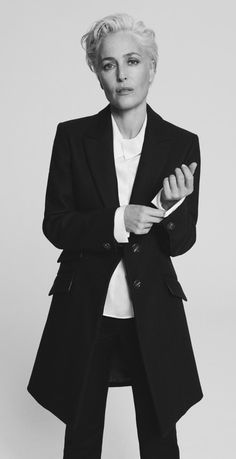 a woman in a black jacket and white shirt