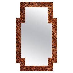 a mirror that is made out of wood and has an intricate design on the frame