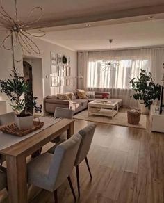 a living room filled with furniture and a wooden table