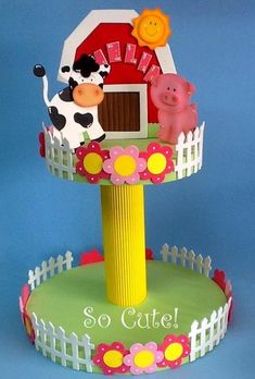 there is a cake made to look like a farm scene with animals on the top