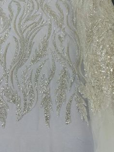 White Embroidered Sequin Fabric For Reception, White Embellished Embroidered Fabric For Reception, White Embellished Embroidered Fabric For Ceremony, Elegant White Beaded Embroidered Fabric, Elegant White Embroidered Beaded Fabric, White Wedding Dress With Intricate Embroidery For Reception, White Embroidered Fabric For Reception, White Embellished Embroidered Fabric For Festive Occasions, Festive White Embellished Embroidered Fabric