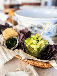 a bowl filled with sliced avocado and chips