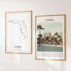 two framed maps hang on the wall next to each other in front of palm trees