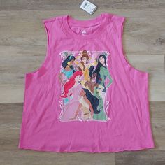 a pink tank top with disney princesses on it