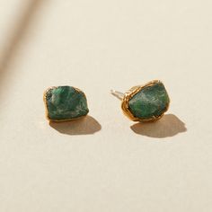 "EMERALD STUDS Finally, earrings for the everyday. Elevated yet grounded, these go-to studs are set with natural emeralds and imbued with an understated strength and power. Emerald gems are known to encourage ease and natural confidence. Like the fresh energy and growth of Spring, these green beauties stimulate a clear mind and path forward. May's birthstone, they're a perfect gift for the strong and intuitive females in your life of any age, stage, and style. DETAILS * Stones measure approximat Anniversary Jewelry For Her, Emerald Anniversary, Emerald Studs, Emerald Stud Earrings, Raw Gemstone Jewelry, Modern Gold Jewelry, Raw Emerald, Emerald Earrings Studs, Gem Earrings