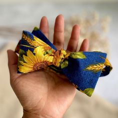 "Beautiful sunflower with blue background self tie bow tie, necktie with matching pocket square. Perfect for Summer/autumn/sunflower themed wedding.  Available in... 🌼🪡Hand-sewn semi skinny Adult Neck Tie (3\" in width) 🌻 Self tie Bow tie (adjustable strap) 🌻Matching Pocket square. ✂️Material: 100% Premiun COTTON, 100% Wool interlining 📏Measurements:  The necktie is 58\" or 147.3 cm appx The widest part measures 3\"  Pocket square measure approximately 10\" squares. Our experienced team has Blue Standard Bow Tie For Father's Day, Blue Bow Tie For Father's Day, Blue Bow Gift For Summer, Summer Bow Tie With Adjustable Ties As Gift, Blue Ties And Pocket Square For Groom, Blue Tie With Bow Tie Back As A Gift, Blue Tie With Pocket Square For Groom, Summer Gift Bow Tie, Blue Standard Bow Tie For Groom