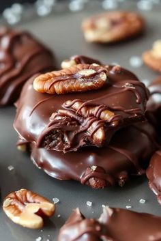 chocolate covered cookies with nuts on top