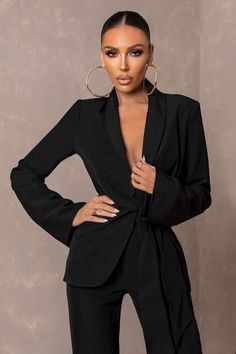 Turn up looking like the ultimate boss babe in the "Undeniable" blazer. Not your average blazer. this relaxed style features a wrap front. belted detail that flatters your curves and accentuates your waistline. The classic black shade is a timeless addition to your wardrobe all year round. pair it with the "In Form" trousers to complete the look.Features- Wrap front- Relaxed style- Knot front tie detail- Matching trousers (CL126036)SizingModel is 5'7 and wears UK size 8 / US size 4Fit Informatio Black Long Sleeve Blazer With Belted Cuffs, Black Blazer With Belted Cuffs, Black Blazer With Belted Cuffs And Long Sleeves, Tailored Black Belted Blazer, Chic Black Blazer With Belted Cuffs, Chic Pantsuit With Suit Collar For Night Out, Black Fitted Belted Blazer, Fitted Long Sleeve Blazer With Belt, Fitted Black Belted Blazer