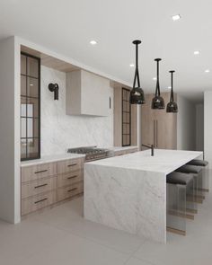 a large kitchen with marble counter tops and wooden cabinets