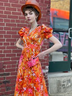 "Extreme Bight Mood Puff Sleeve 70s Hawaiian Print Orange and Pink Spring Maxi Dress. Here comes the sun. In excellent condition with no flaws of note. No tags. Feels synthetic. Back vinyl zip with hook and eye at neck. So beautiful Bust 31\" Waist 24\" Hip 36\" Length 49\" Please message me with questions before purchasing. All sales are final and ship fast from the Vermont shop. Find us on Instagram @anasclosetfullofcolor Thankyou! More vintage dresses here: https://www.etsy.com/shop/anastasia Red Hawaiian Dress For Spring, Vintage Red Maxi Dress For Vacation, Red Vintage Maxi Dress For Vacation, Fitted Bohemian Dress With Tropical Print, Spring Retro Dresses With Tropical Print, Retro Short Sleeve Maxi Dress For Beach, Retro Short Sleeve Maxi Dress For The Beach, Fitted Tropical Maxi Dress For Garden Party, Vintage Orange Floral Print Dress