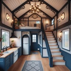 a kitchen and stairs in a tiny home