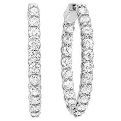 Nothing says luxury like an incredible pair of diamond oval hoop earrings. These stunning brightly polished 14 karat white gold inside out round-shaped hoop earrings feature a total of 42 round brilliant cut diamonds totaling 3.00 carats are prong set on the outside front and inside, creating a double dose of incredible scintillation and fire. These are I-J color and SI clarity. Hinges on the bottom and click top posts secure these glamorous hoop earrings that are perfect for any occasion. Bracelets Wedding, Diamond Earrings For Women, Diamond Hoop Earrings, 3 Carat, 2 Carat, Jewelry Earrings Hoops, Oval Diamond, Round Brilliant Cut Diamond, Round Brilliant