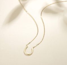 The horseshoe itself is said to be a symbol for luck. Many people wear jewelry with a horseshoe symbol on it to bring them luck. This simple design horseshoe necklace would bring you luck! Material: 14K yellow gold Pendant Size: 0.47*0.47 inch (12*12mm) Necklace length: 16 inch + 2 inch Symbol For Luck, Horseshoe Necklace Gold, Horseshoe Necklace, Yellow Gold Necklace, Necklace Online, Yellow Gold Pendants, Necklace Length, Solid Yellow, Gold Pendant