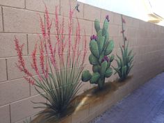 a mural on the side of a building with plants painted on it