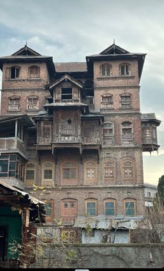 an old building with many windows and balconies