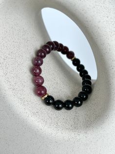 💎 MATERIAL DETAILS ○ 8mm Red Garnet → love, strength, creativity, and transformation  ○ 8mm Black Onyx → perseverance, protection, and strength ○ 6mm 18k gold plated spacers ○ High quality, resistant, and flexible elastic cord (double-corded) 💯 QUALITY & CRAFTSMANSHIP ○ Materials are handpicked, inspected, and handled with the utmost quality and care ○ Double-corded with high quality elastic cord - this means our bracelets have 2x the durability of other stretch bracelets!  ○ Seamless knotting Protection Bracelet, Red Gemstones, Red Garnet, Gemstone Bracelet, Bead Bracelet, Jewelry Ideas, Stretch Bracelets, Black Onyx, Etsy Australia