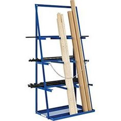 a blue shelf with two wooden dows on the bottom and one piece of wood in it