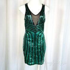 Sparkling Green And Black Sequins That Will Catch The Light And Turn Heads. A Flattering Bodycon Silhouette That Hugs Your Curves And Accentuates Your Figure. A Flirty Mini Length That Shows Off Your Legs. Trendy Mesh Cutouts That Add A Touch Of Edge And Intrigue. A Sleeveless Design That's Perfect For Warmer Weather Or Layering With A Jacket. This Dress Is Perfect For A Night Out Dancing, A Club Look, Or Any Special Occasion Where You Want To Make A Statement. Size: Small Measurement When Lays Flat: Shoulder 10". Chest 32", Waist 26", Hips 33", Length 34" Condition: Preowned, In Very Good Condition "Please View Pictures For Specific Item Conditions" Item#3991 Club Look, View Pictures, Bebe Dresses, Green And Black, Black Sequins, Bodycon Mini Dress, Dancing, Night Out, Layering