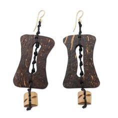 Nonyem Abena Ibeneme combines the rich natural beauty of coconut shell and bamboo for the design of these earrings. The organic colors and style of this design makes me think of medieval architecture says the Nigerian-born designer of the handcrafted earrings. Brown Drop Earrings For Beach, Brown Drop Earrings For The Beach, Adjustable Brown Earrings With Wooden Beads, Brown Dangle Earrings Nature-inspired, Nature-inspired Brown Dangle Earrings, Wooden Beads Earrings For Beach, Wooden Beaded Earrings For Beach, Unique Brown Earrings For Beach, Traditional Adjustable Earrings With Wooden Beads