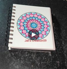 a spiral notebook with the words jail's creations on it