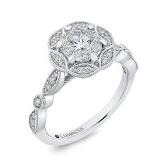 a white gold engagement ring with diamonds on it