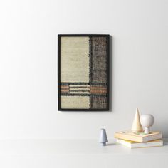 a white table topped with books and vases