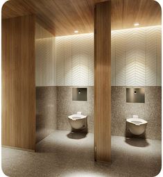 an empty bathroom with two toilets in the middle and one on the other side, all made out of wood