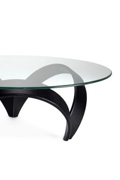 an oval glass table with black legs and a curved design on the top, against a white background