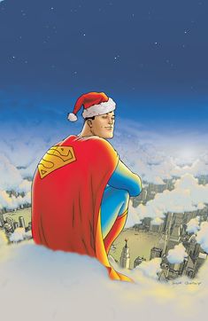 a man wearing a santa hat and cape sitting on top of a snow covered hill