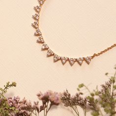 Inspired by the White Lilac Flower, this necklace shimmers with purity and innocence, making it an angelic addition to your necklace stack or as your look's centerpiece. Delicate Gold Necklaces With Sparkling Stones, Dainty Yellow Gold Necklace With Sparkling Stones, Delicate Gold-plated Diamond Necklace, Delicate Gold Plated Diamond Necklace, Delicate Cubic Zirconia Necklace With 17 Jewels, Necklace Stack, White Lilac, Lace Necklace, Gold Statement Necklace