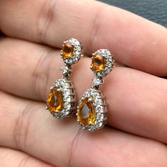 ENJOY OUR WORRY-FREE SERVICE AND THE DAZZLING, GENUINE JEWELRY WE DESIGN AND HANDCRAFT WITH LOVE❤️ ABOUT THE ITEM: CERTIFIED 4.22 Total Carats, Thai yellow sapphires and 1.02 carats of E/VVS, natural diamonds, set in handmade 8.5 grams, 18K solid gold, CHIC dangling earrings. ONE OF A KIND HANDCRAFTED EARRINGS. WE OFFER FREE CHRISTMAS GIFT PACKAGING, CHRISTMAS CARD WITH PERSONAL NOTES, FREE RING SIZING AND FREE-OF-CHARGE 14-DAY RETURN! FREE 2 Days UPS EXPRESS SHIPPING! Grab now before too late I Luxury Pear-shaped Earrings As Gift, Luxury Pear-shaped Earrings For Gift, Luxury Teardrop Diamond Earrings As A Gift, Fine Jewelry Pear-shaped Chandelier Earrings For Anniversary, Pear-shaped Fine Jewelry Chandelier Earrings For Anniversary, Dazzling Drop Bridal Earrings Gift, Luxury Pear-shaped Diamond Earrings As Gift, Luxury Pear-shaped Diamond Earrings Gift, Hallmarked Pear-shaped Fine Jewelry Earrings