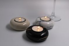 three candles sitting next to each other on a table