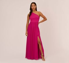 a woman wearing a pink one shoulder gown with thigh high slits and an asymmetric