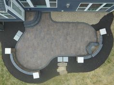 an aerial view of a patio with seating