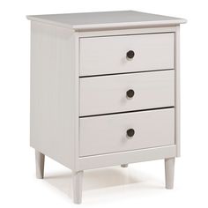 a white nightstand with three drawers on one side and two black knobs on the other