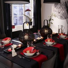 a dining room table set with place settings