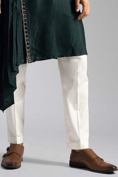 Emerald green kurta featuring side placket with thread and mirrorwork detail. Comes with pant. - Aza Fashions Traditional Cotton Pants With Embroidered Border, Cotton Pants With Embroidered Border, Traditional Green Kurta For Work, Traditional Green Straight Pants, Traditional Cotton Bottoms With Dupatta, Traditional Embroidered Pants For Workwear, Traditional Green Bottoms With Resham Embroidery, Traditional Cotton Pants With Intricate Embroidery, Green Embroidered Cotton Pants