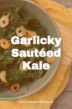 a bowl filled with cooked kale on top of a yellow towel