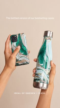 two people holding up their cell phones in front of the camera and one is holding a water bottle