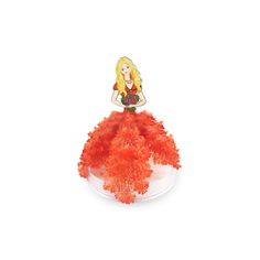 a doll sitting on top of a red feathered object in the shape of a woman