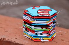 a stack of cat in the hat fabric coasters