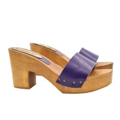 As versatile as they are cool, clogs in their minimal simplicity conquer everyone's most sophisticated and sought-after wardrobes. Clogs can wonderfully complete any kind of outfit and are the right compromise between comfort and elegance. Brown wooden base clogs Purple leather band Heel height 9 cm and plateau 3 cm Stable and comfortable made entirely in ITALY. Craftsmanship. BEFORE COMPLETING YOUR PURCHASE DO NOT FORGET TO CHECK THE SIZE! Length along the curve: 37 EU = 6 US = UK 5 = 24.50 CM Purple Slip-on Clogs For Summer, Purple Closed Toe Clogs For Summer, Summer Purple Closed Toe Clogs, Casual Purple Leather Heels, Purple Open Heel Heels With Removable Insole, Purple High Heel Shoes With Leather Sole, Purple High Heels With Leather Sole, Red Clogs, Purple High Heels